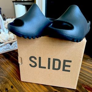 Brand new Yeezy slides black size 8 .